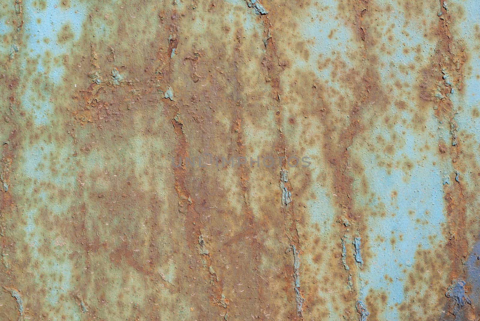 surface of rusty iron with remnants of old paint, grunge metal surface, texture background by uvisni