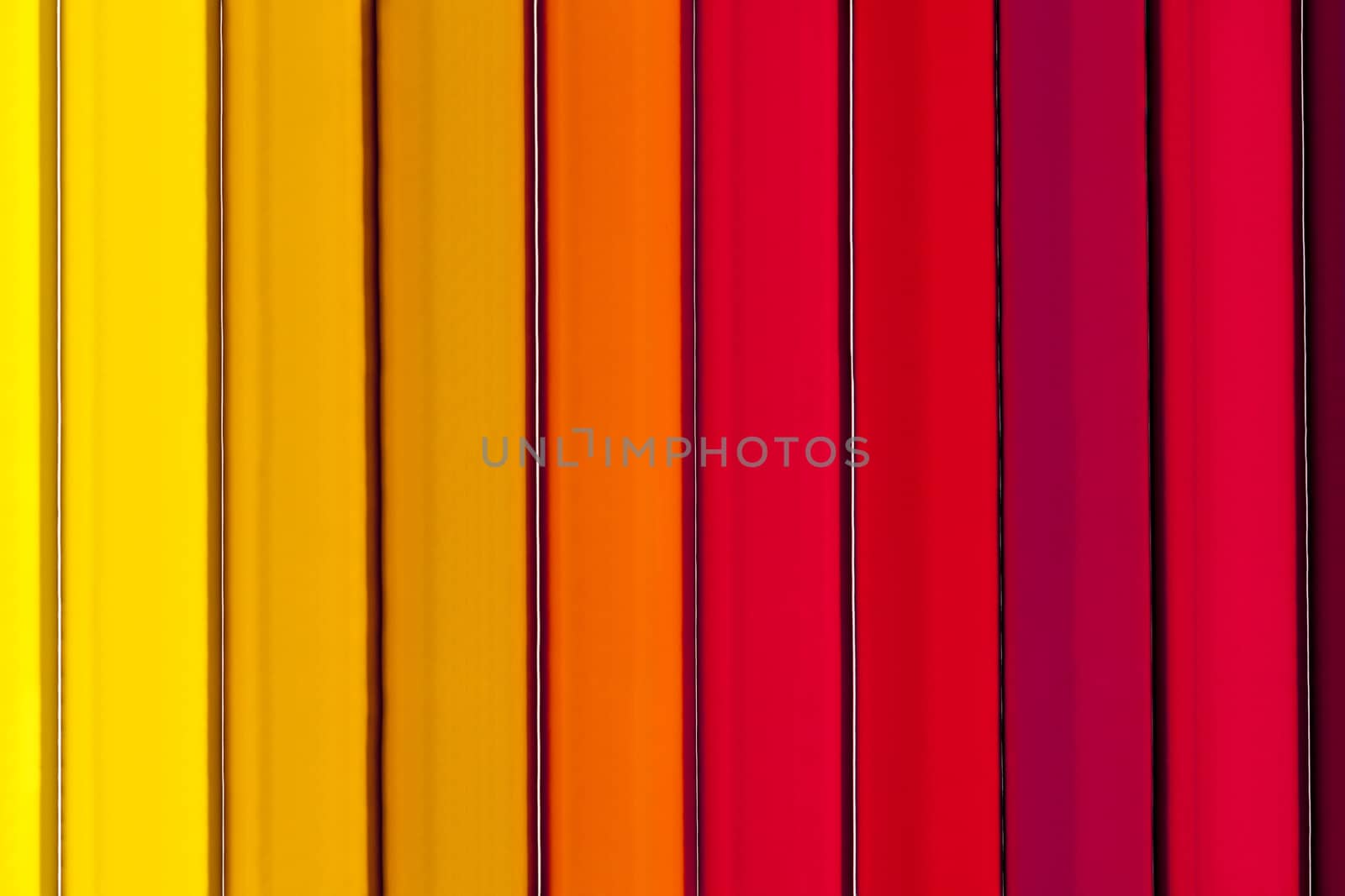 Background of parallel colorful pencils, abstract,close up