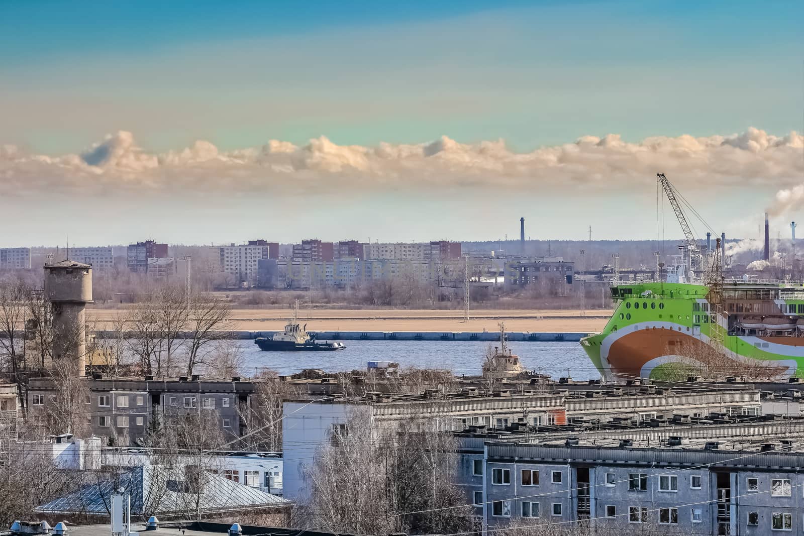 Green cruise liner. Passenger ferry sailing past the Riga city