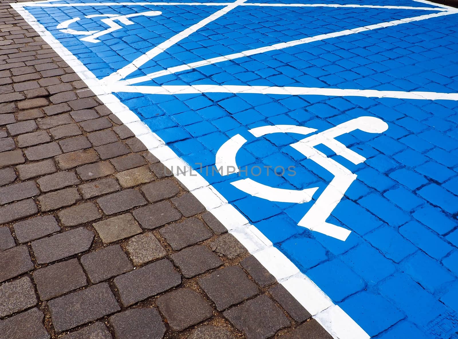 Two parking spaces for disabled people painted on the street.