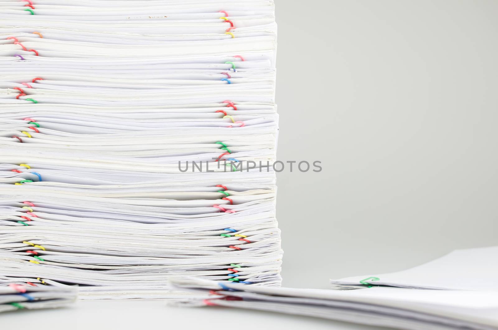 Pile overload paperwork on left have blur pile document around by eaglesky