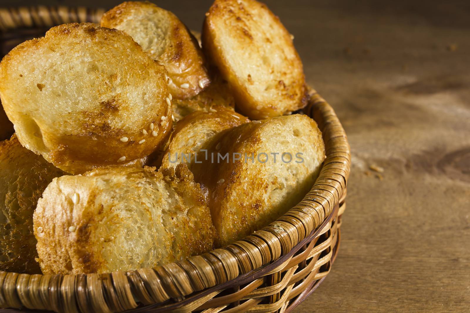 Grilled slices of French bread in a wicker basket