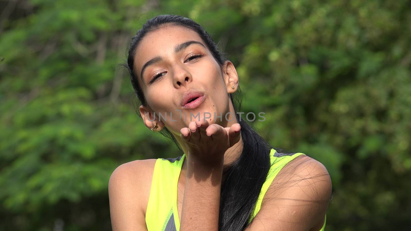 Female Teenager Blowing Kisses