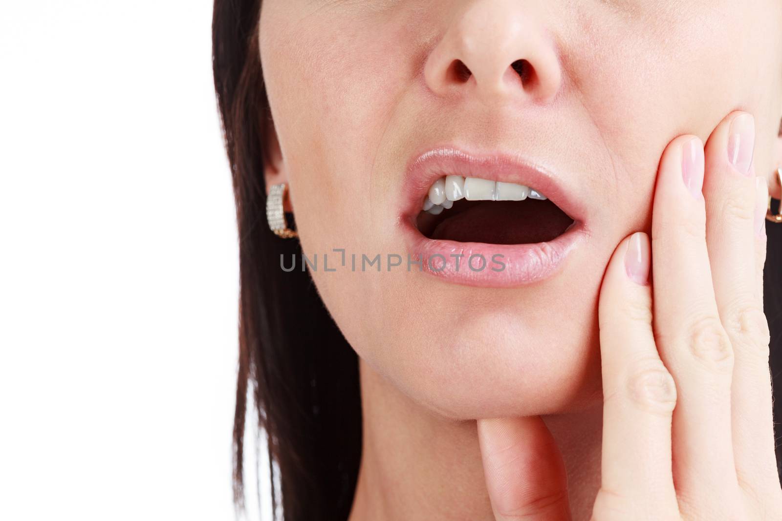 Closeup of woman in strong toothache pain with hands over face. Dental health and care concept. Isolated on white background.