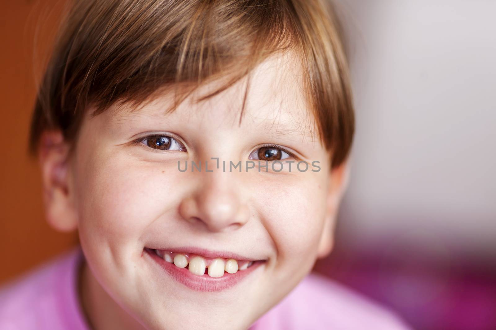 Happy Eight years girl wearing bangs closeup portrait focus on left eye