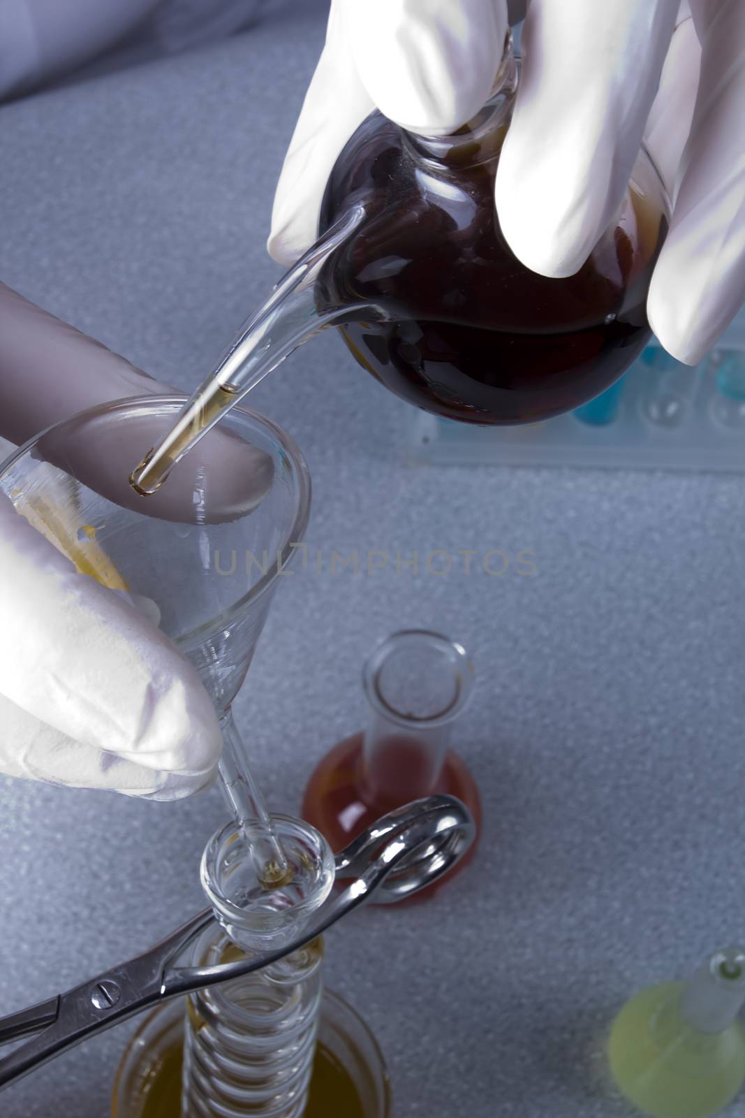 Hands chemist doing research in a laboratory