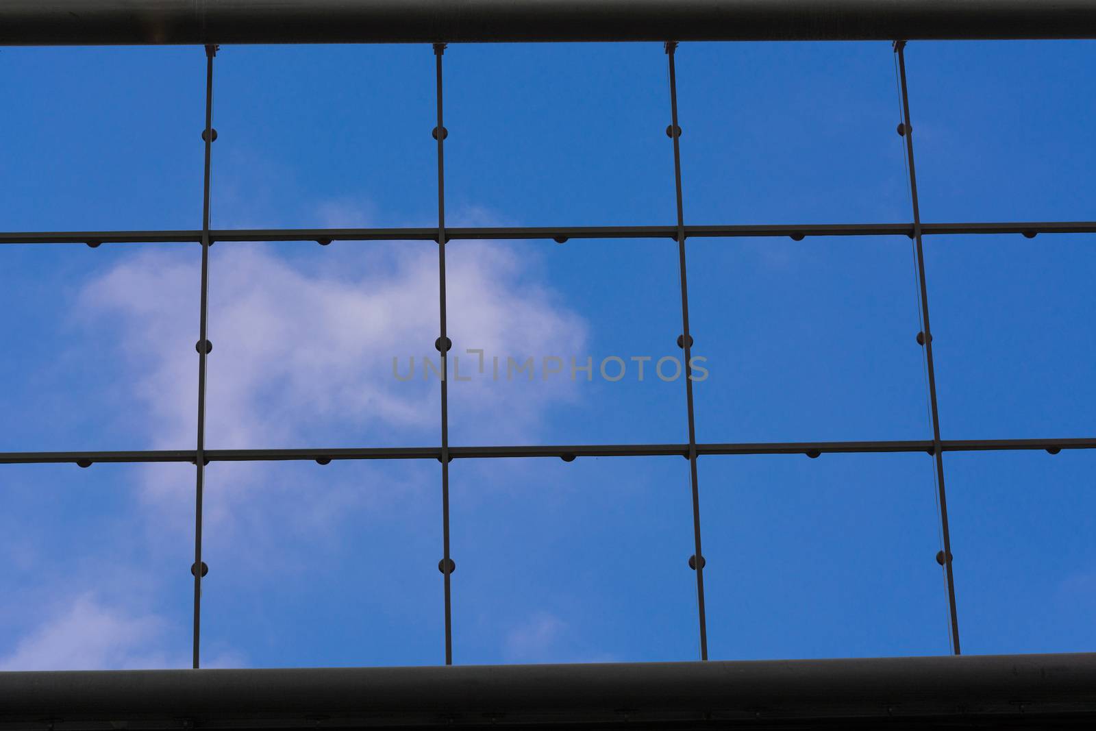 Modern office building with glass facade as a background.