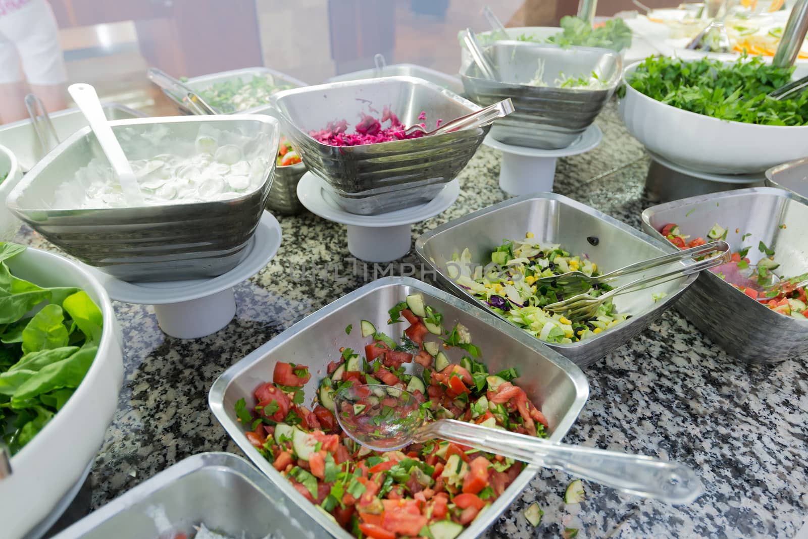 Buffetis a portioned salads on the table