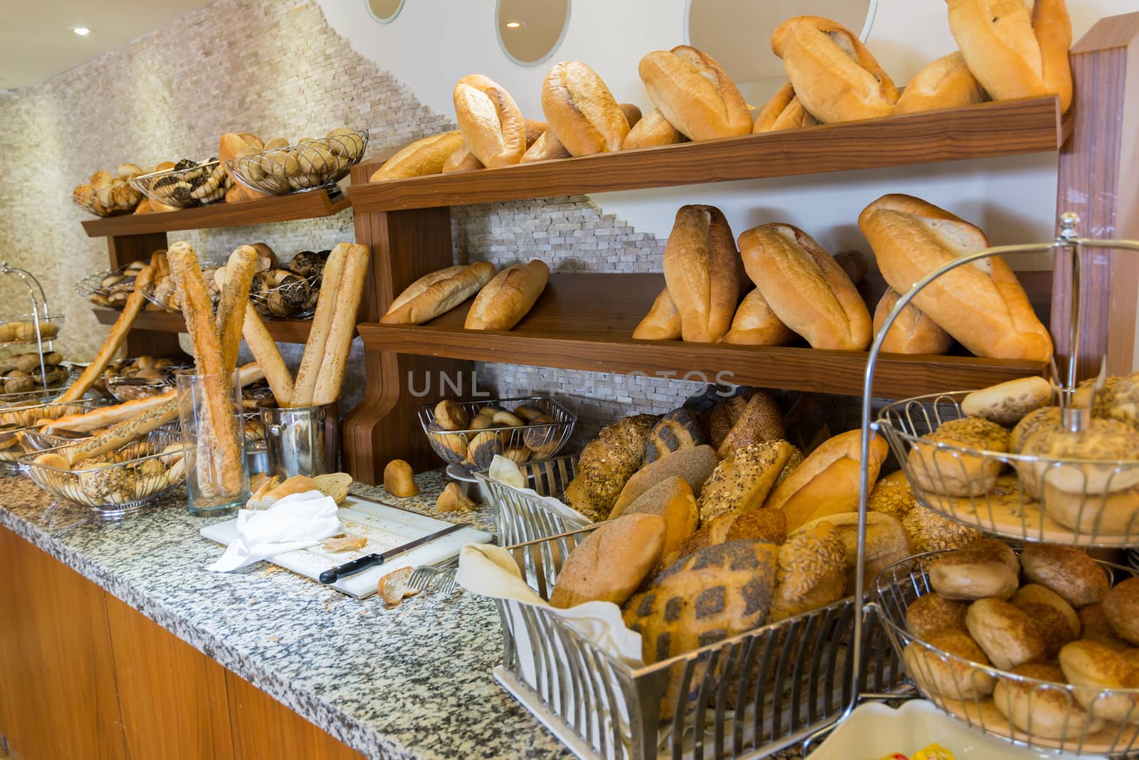 Delicious bread on  counter shop by olgavolodina