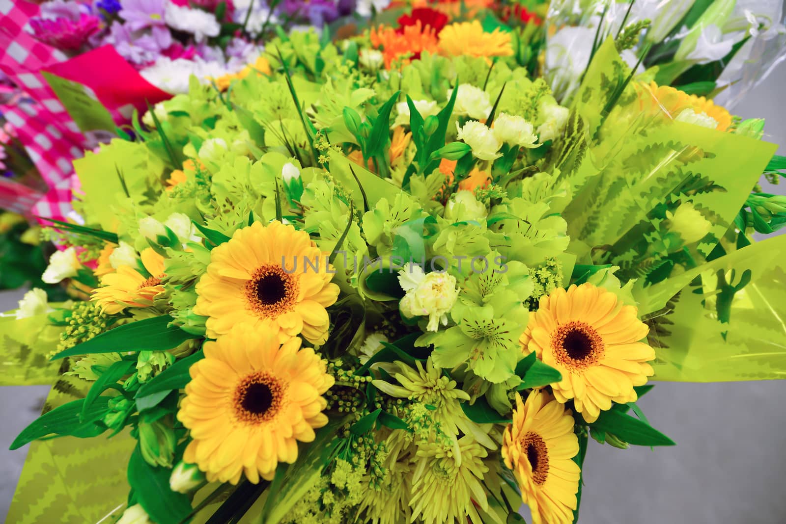 flower bouquet with a lot of different flowers by olgavolodina