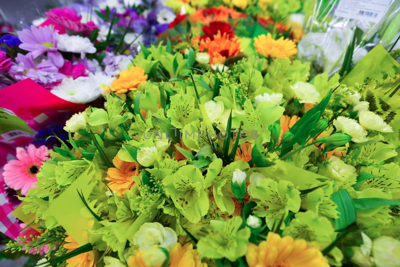 A flower bouquet with a lot of a different flowers