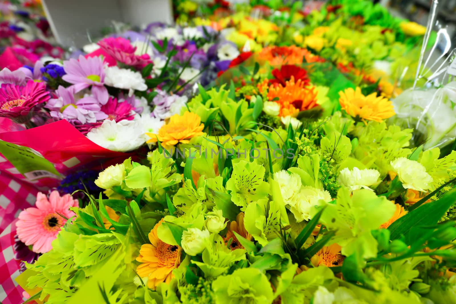 A flower bouquet with a lot of a different flowers