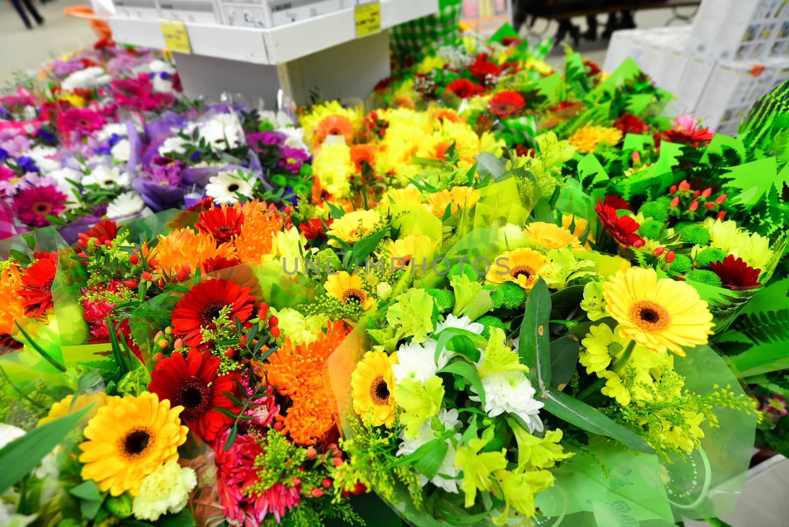 A flower bouquet with a lot of a different flowers