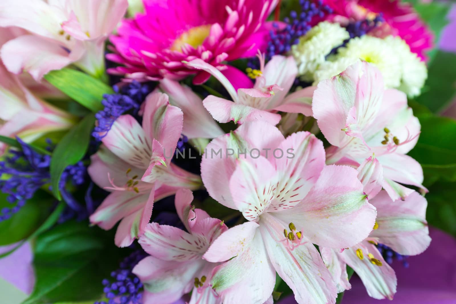 A flower bouquet with a lot of a different flowers