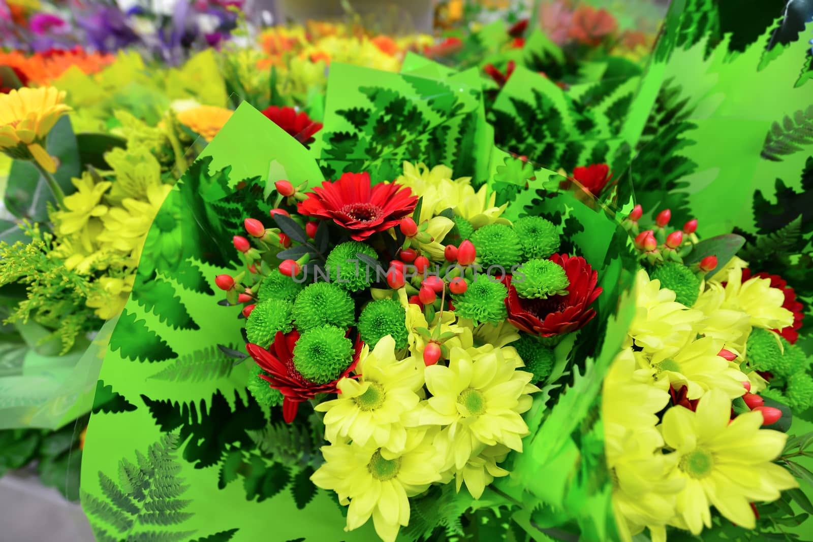 A flower bouquet with a lot of a different flowers