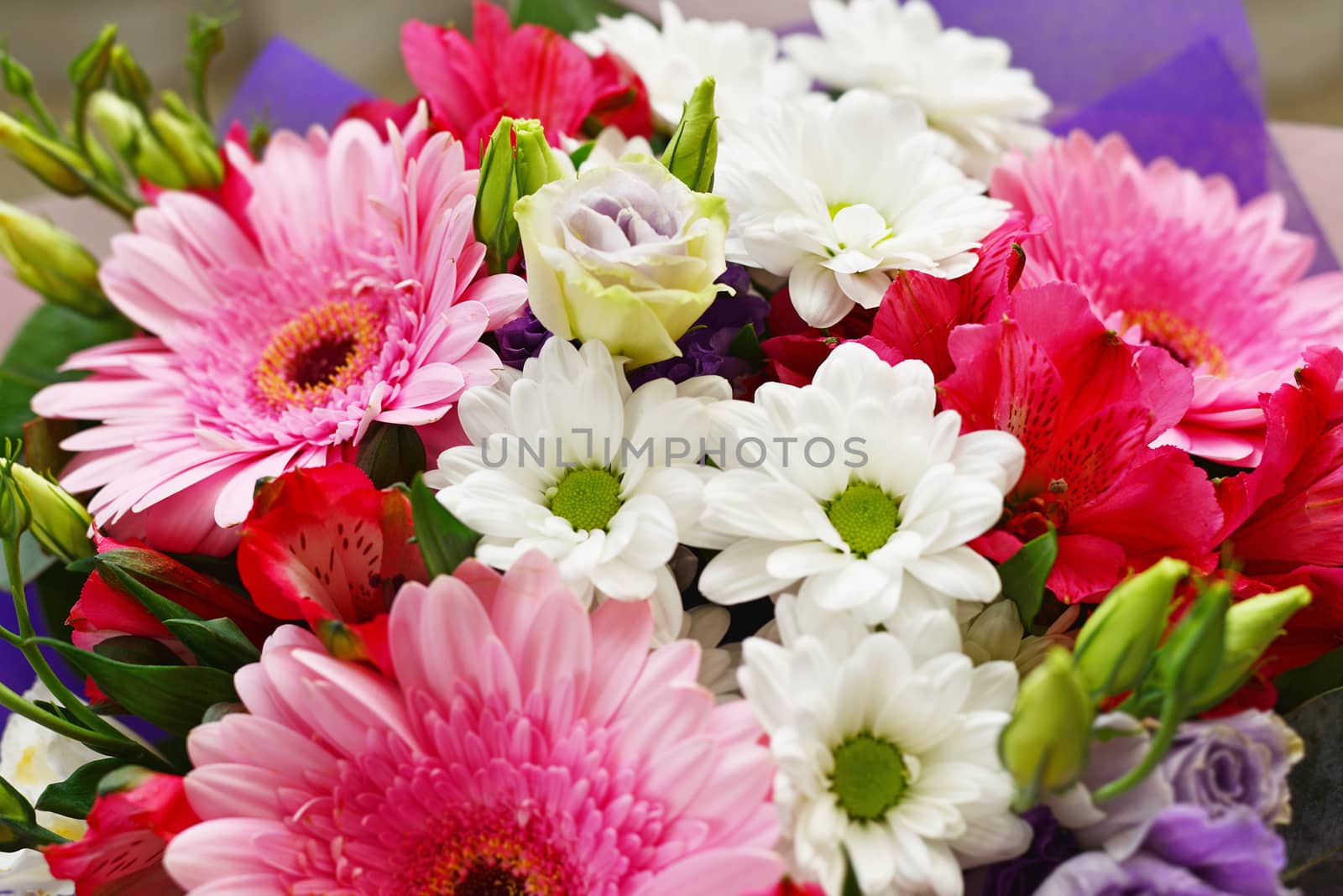 A bouquet of flowers with a gerbera