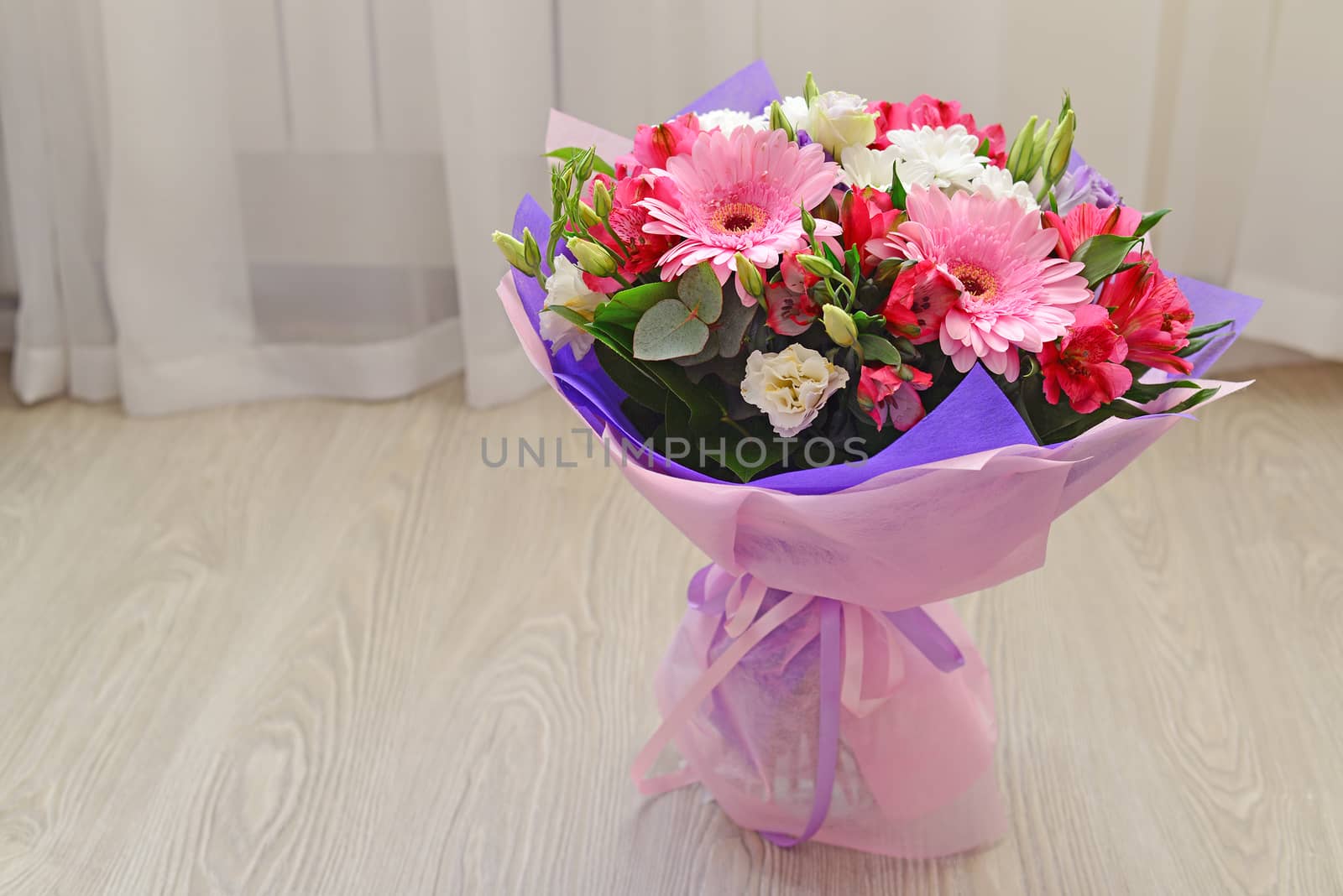 A bouquet of flowers with a gerbera