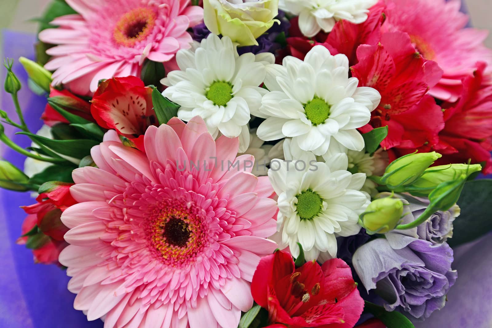 A bouquet of flowers with a gerbera