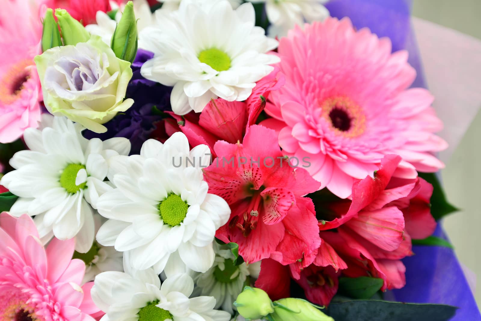 A bouquet of flowers with a gerbera