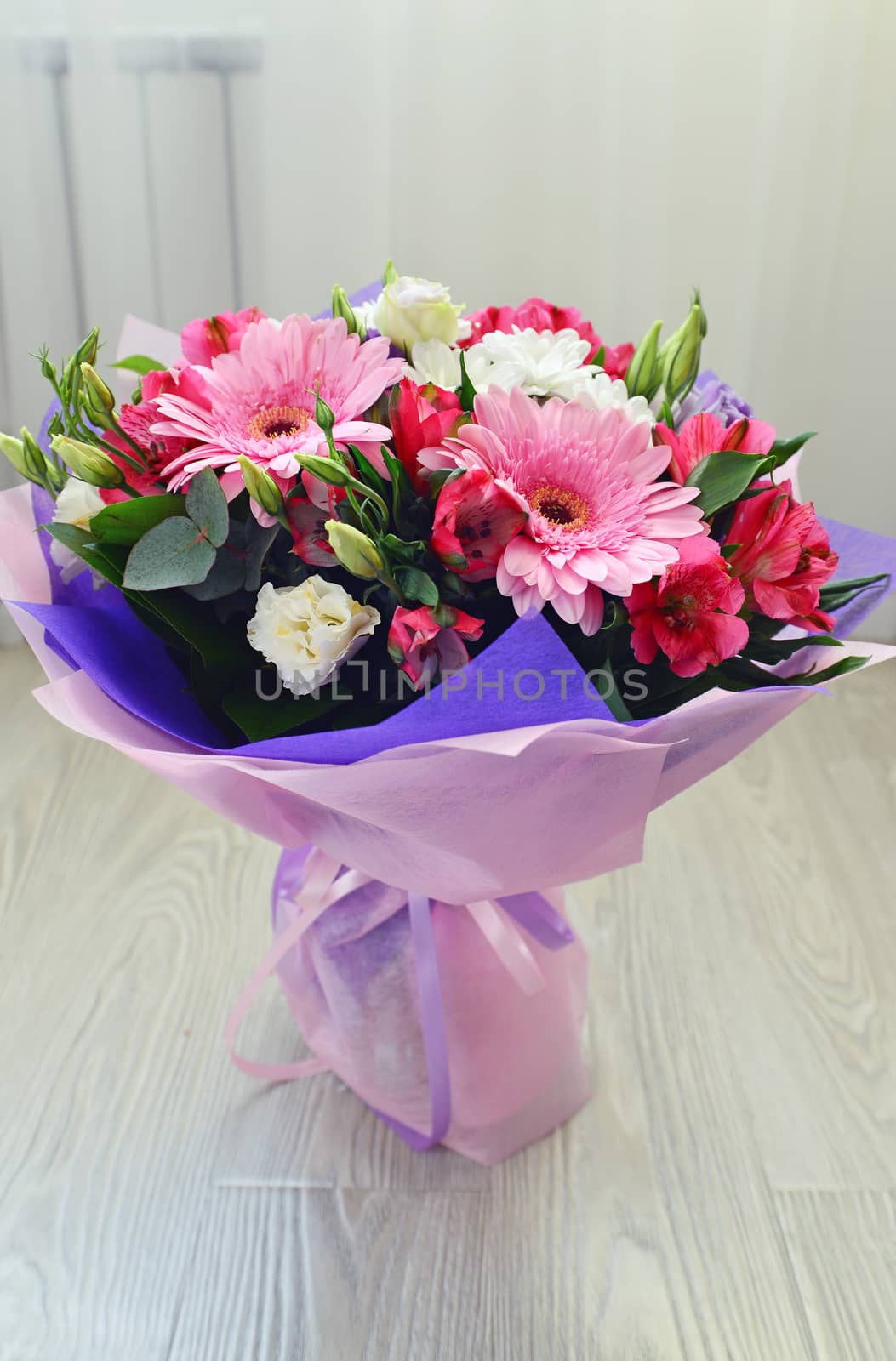 A bouquet of flowers with a gerbera