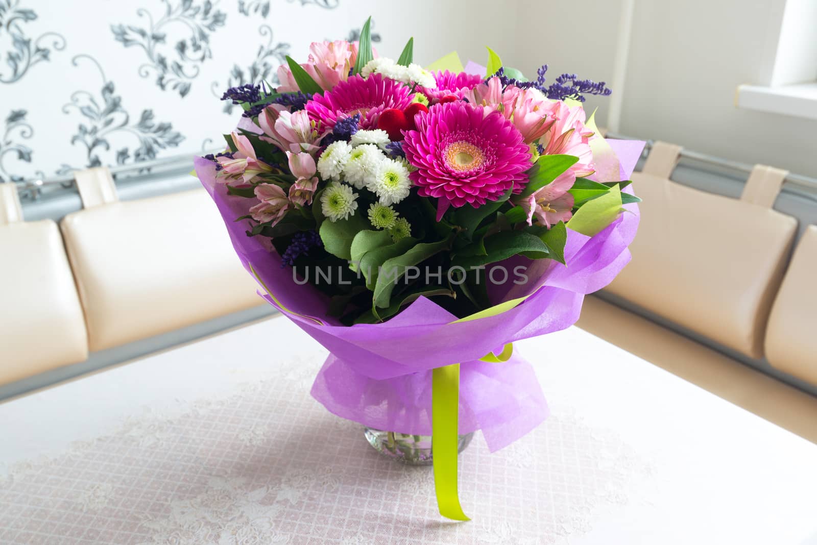 A bouquet of flowers with a gerbera