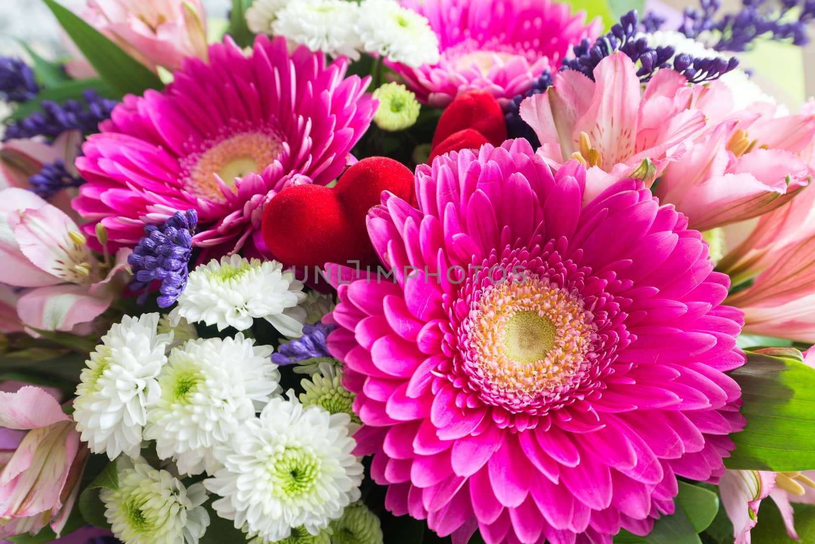 A bouquet of flowers with a gerbera