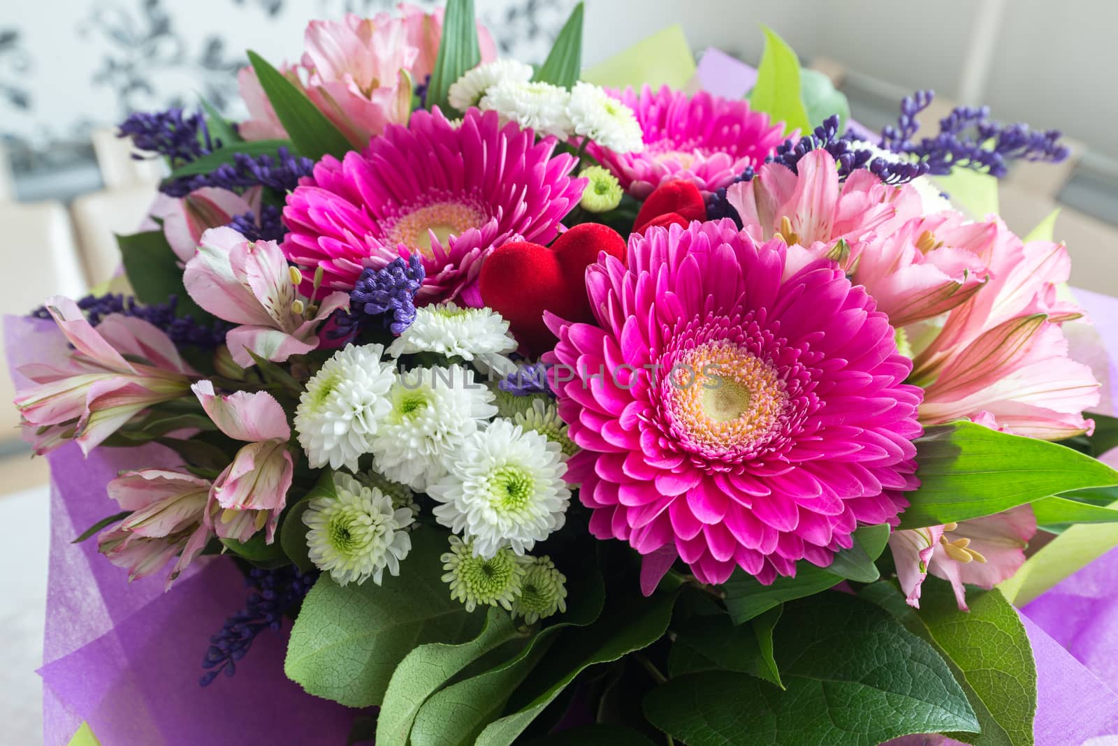 A bouquet of flowers with a gerbera