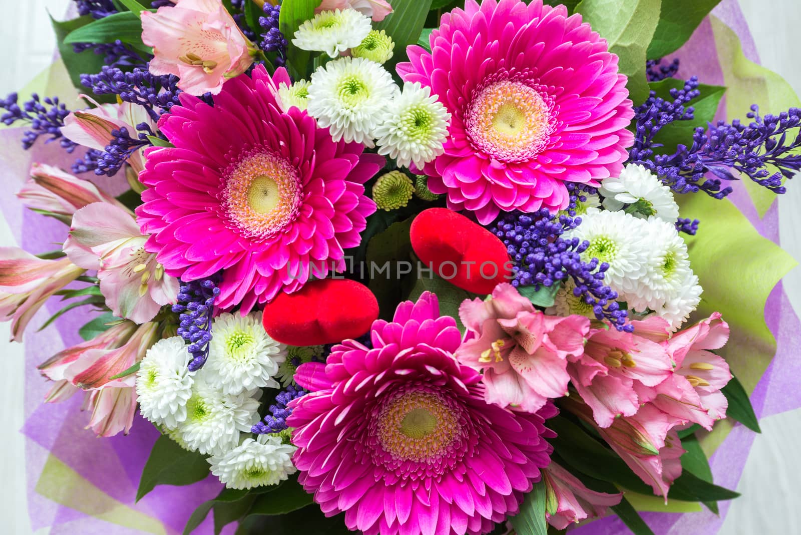 A bouquet of flowers with a gerbera