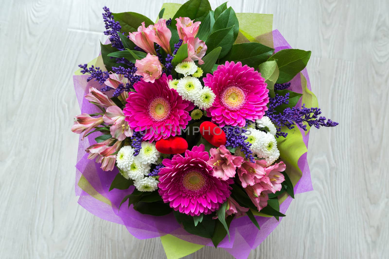 A bouquet of flowers with a gerbera