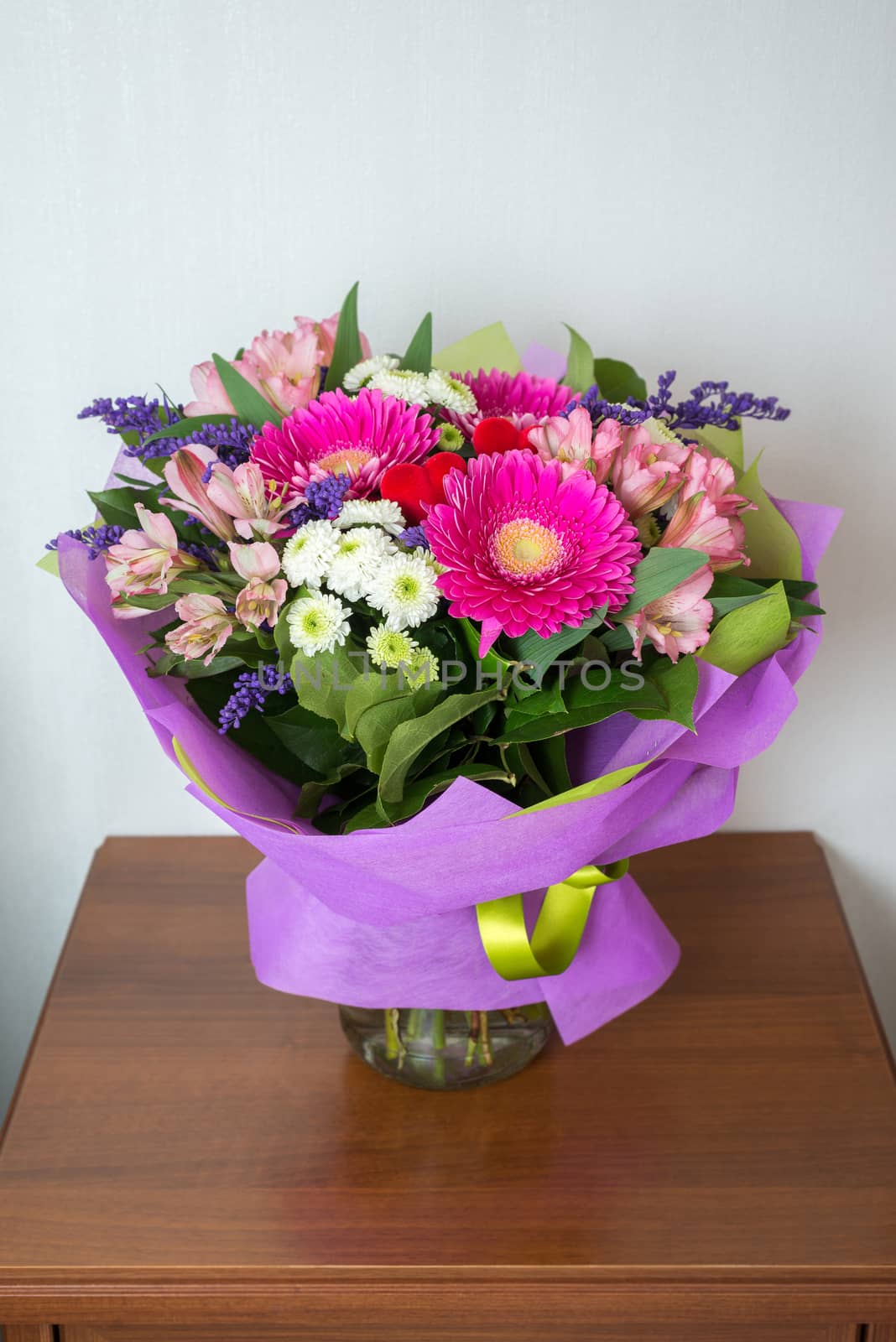 A bouquet of flowers with a gerbera