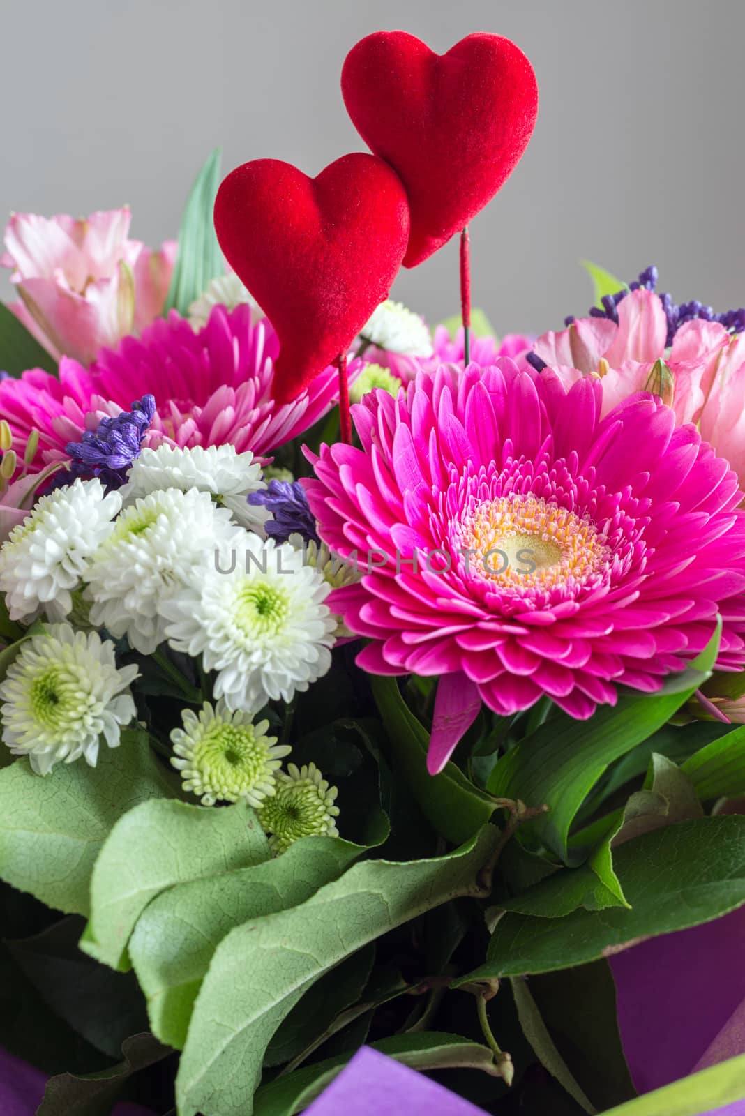 Red hearts and a bouquet of a flowers