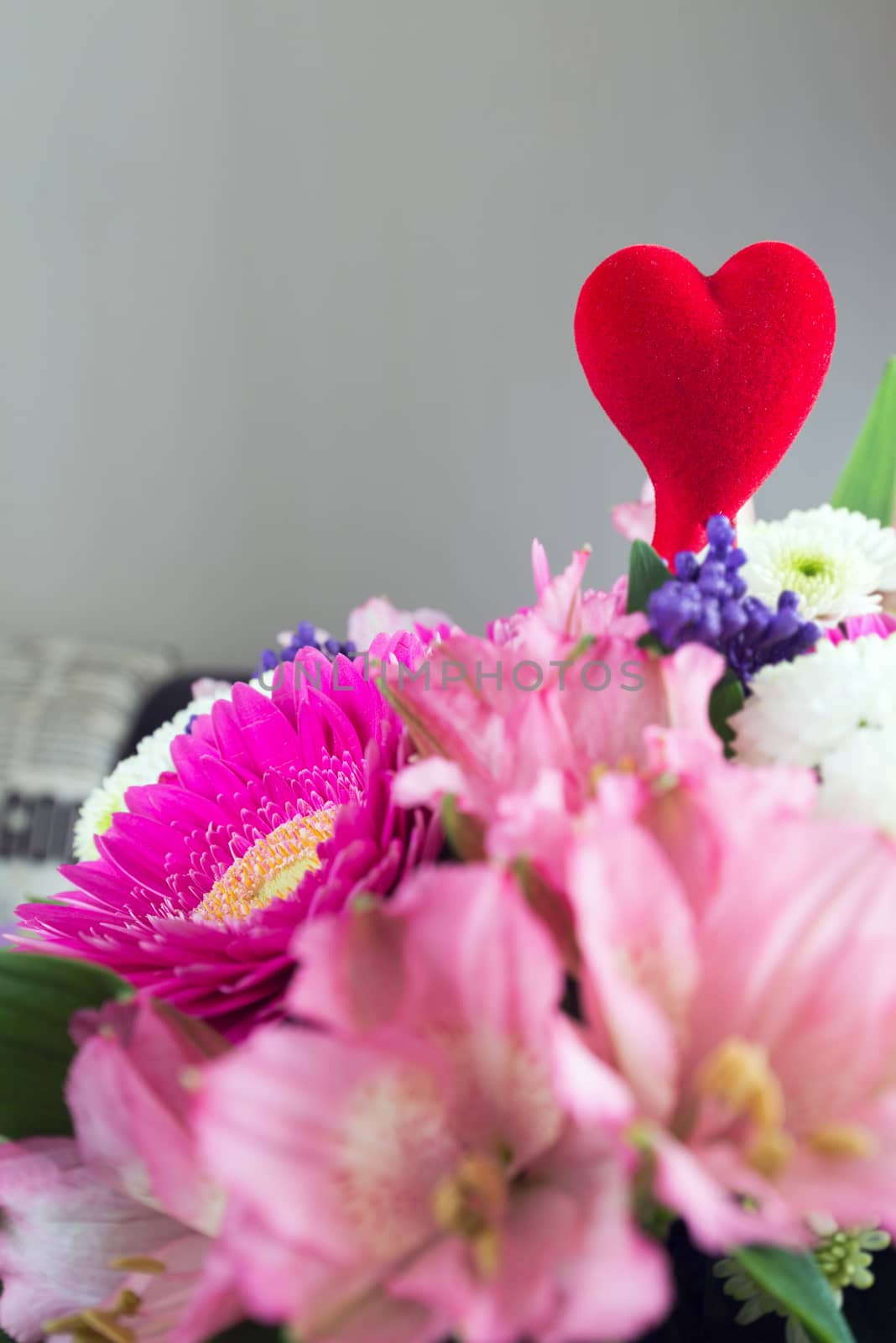 Red hearts and a bouquet of a flowers