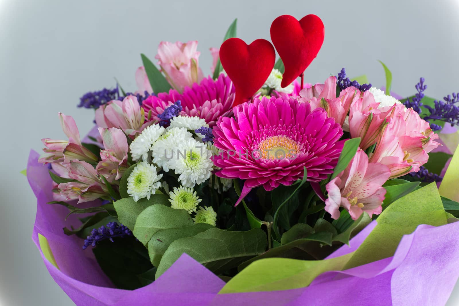 Red hearts and a bouquet of a flowers