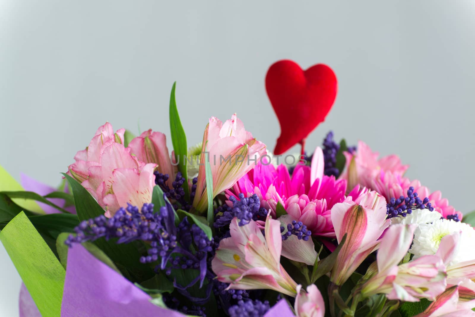 Red hearts and a bouquet of a flowers