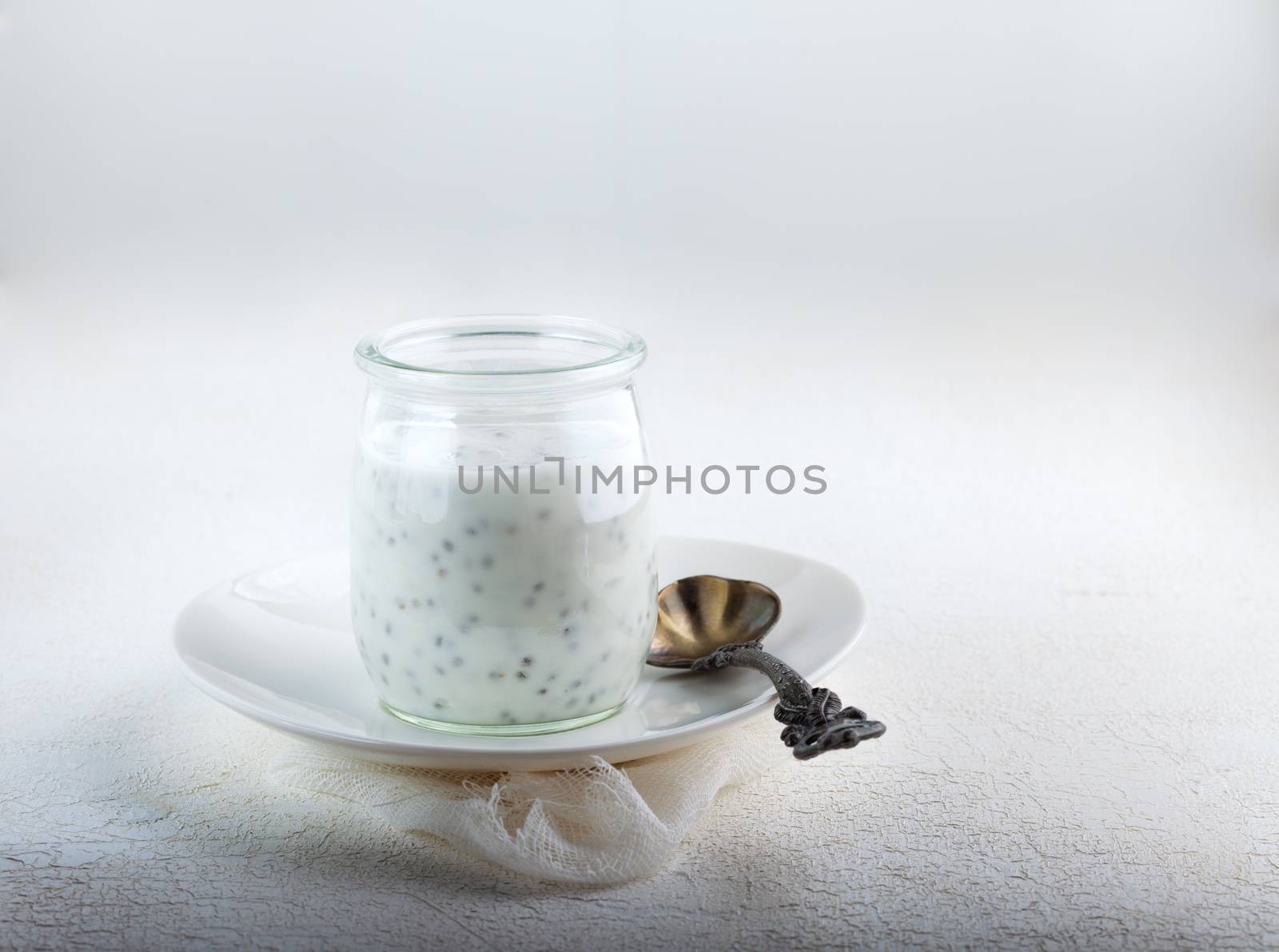 Yogurt with chia seeds with a spoon
