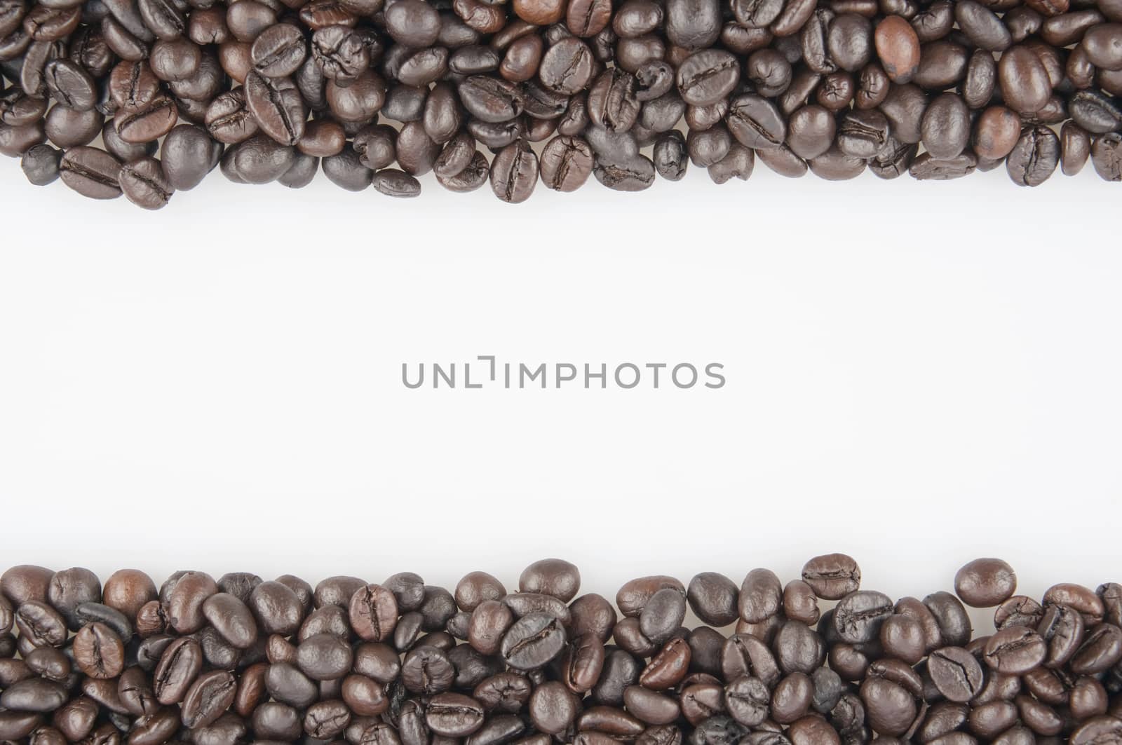 Roasted coffee beans have white space on middle use as texture or background.