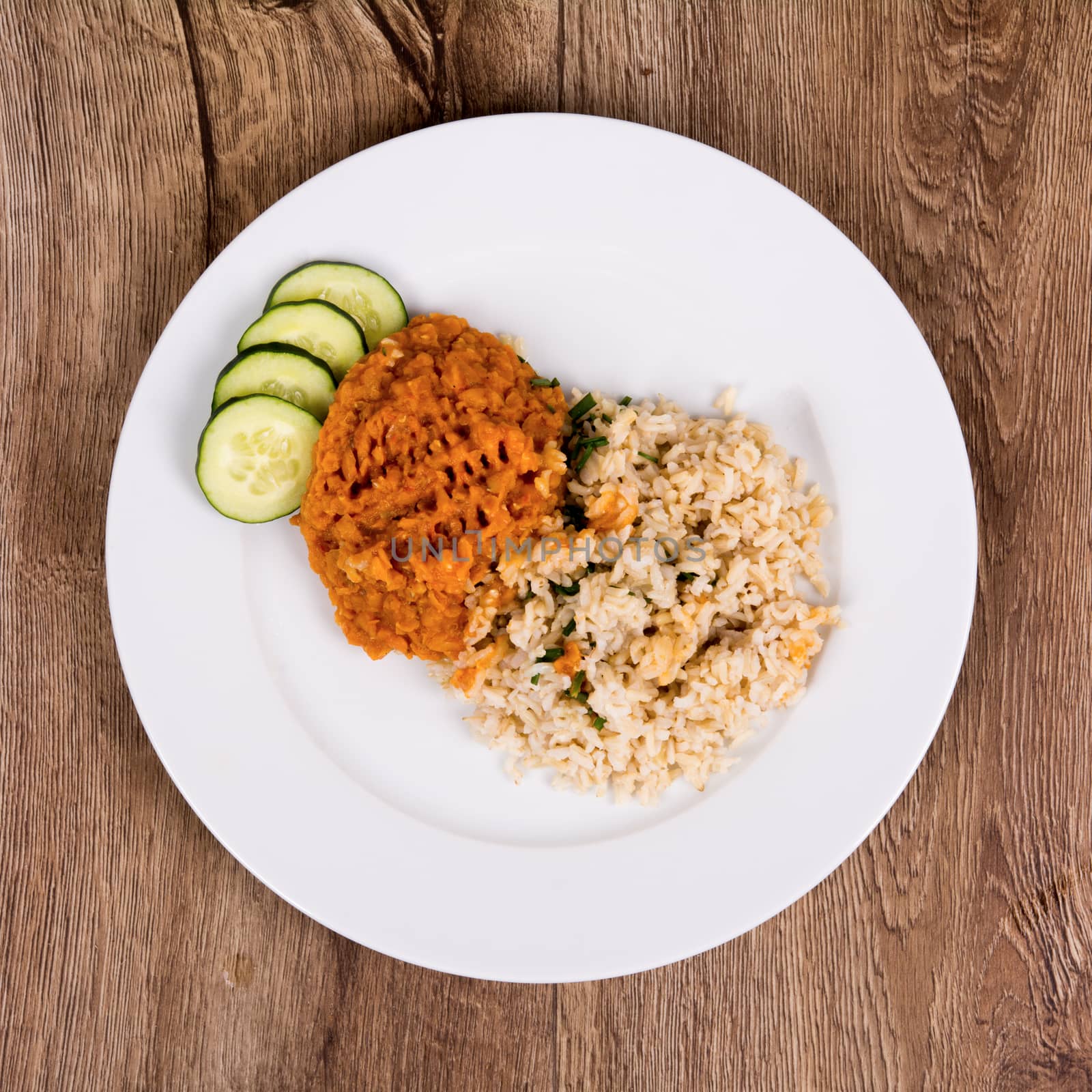 Vegetarian food on a plate with wooden background by neryx