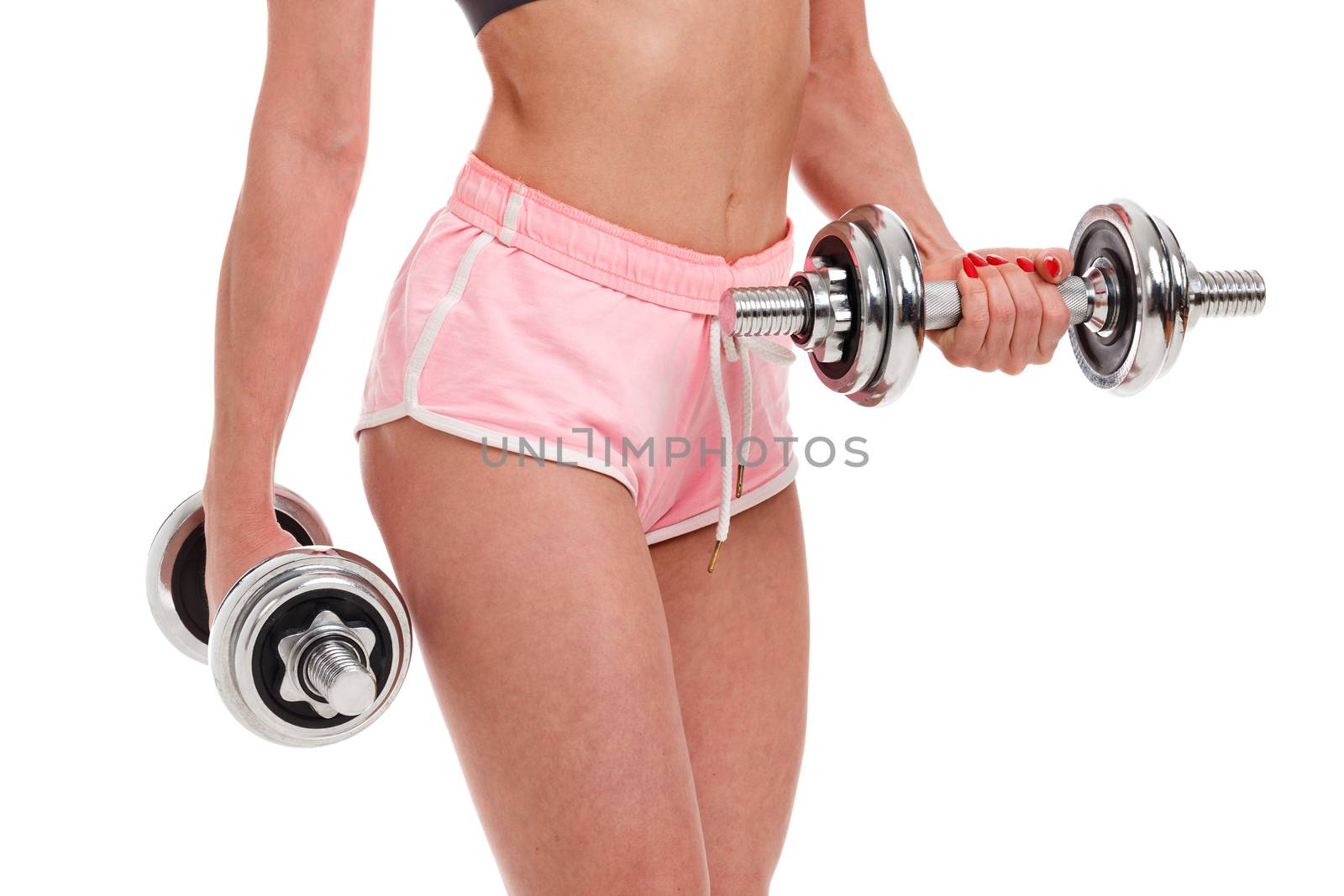 Sexy young fitness woman doing workout with dumbbells, isolated on white background