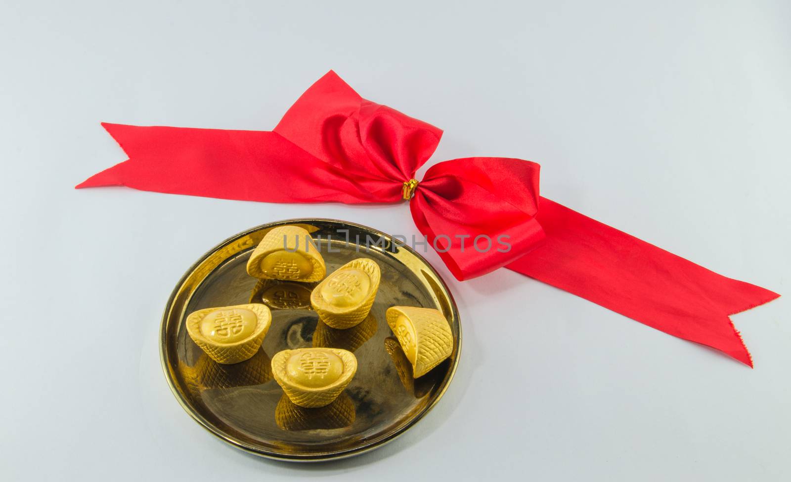  Gold ingot on golden plates white background by metal22