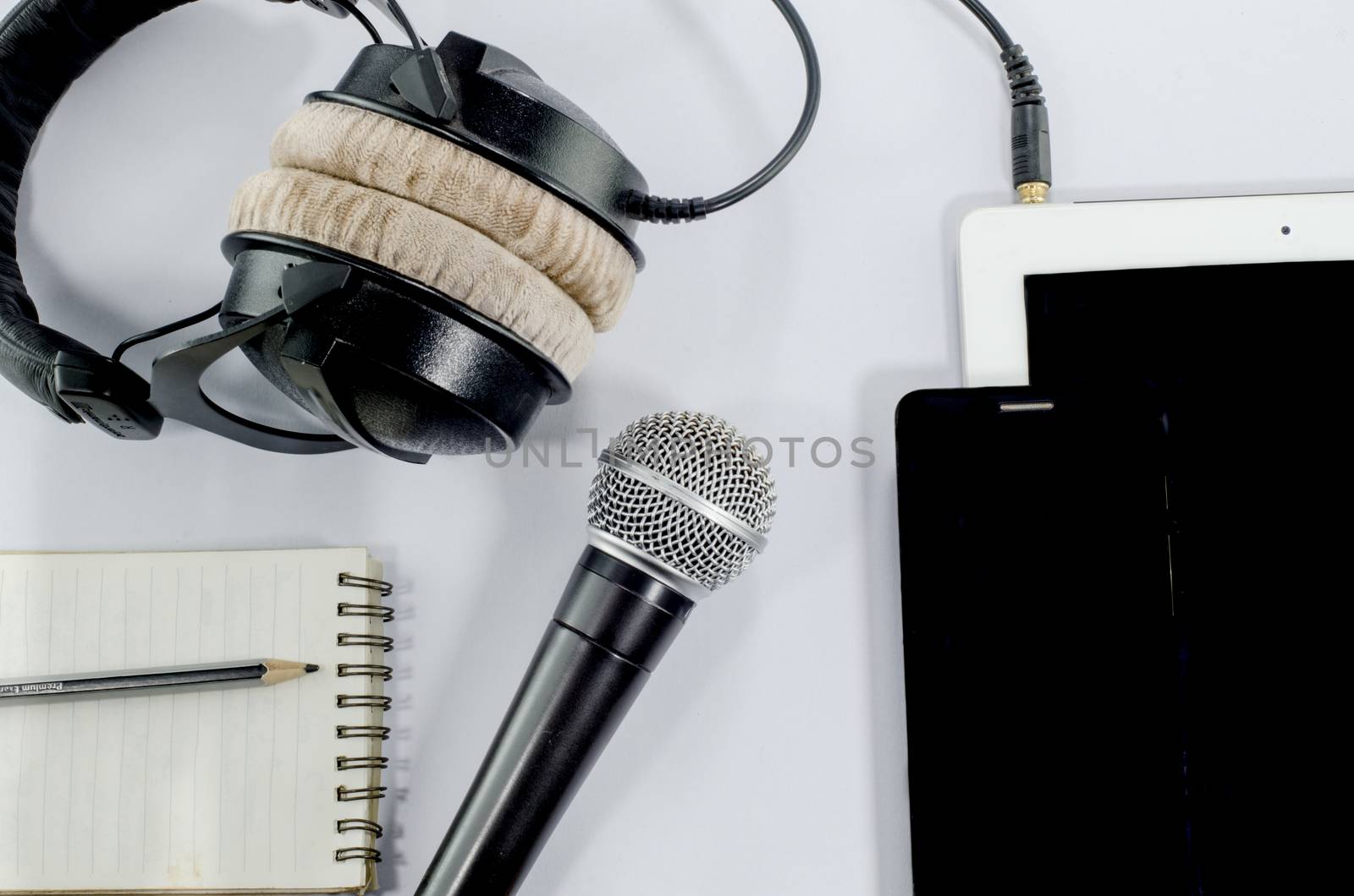 blank notebook in top view with music concept 
whitebackground headphones