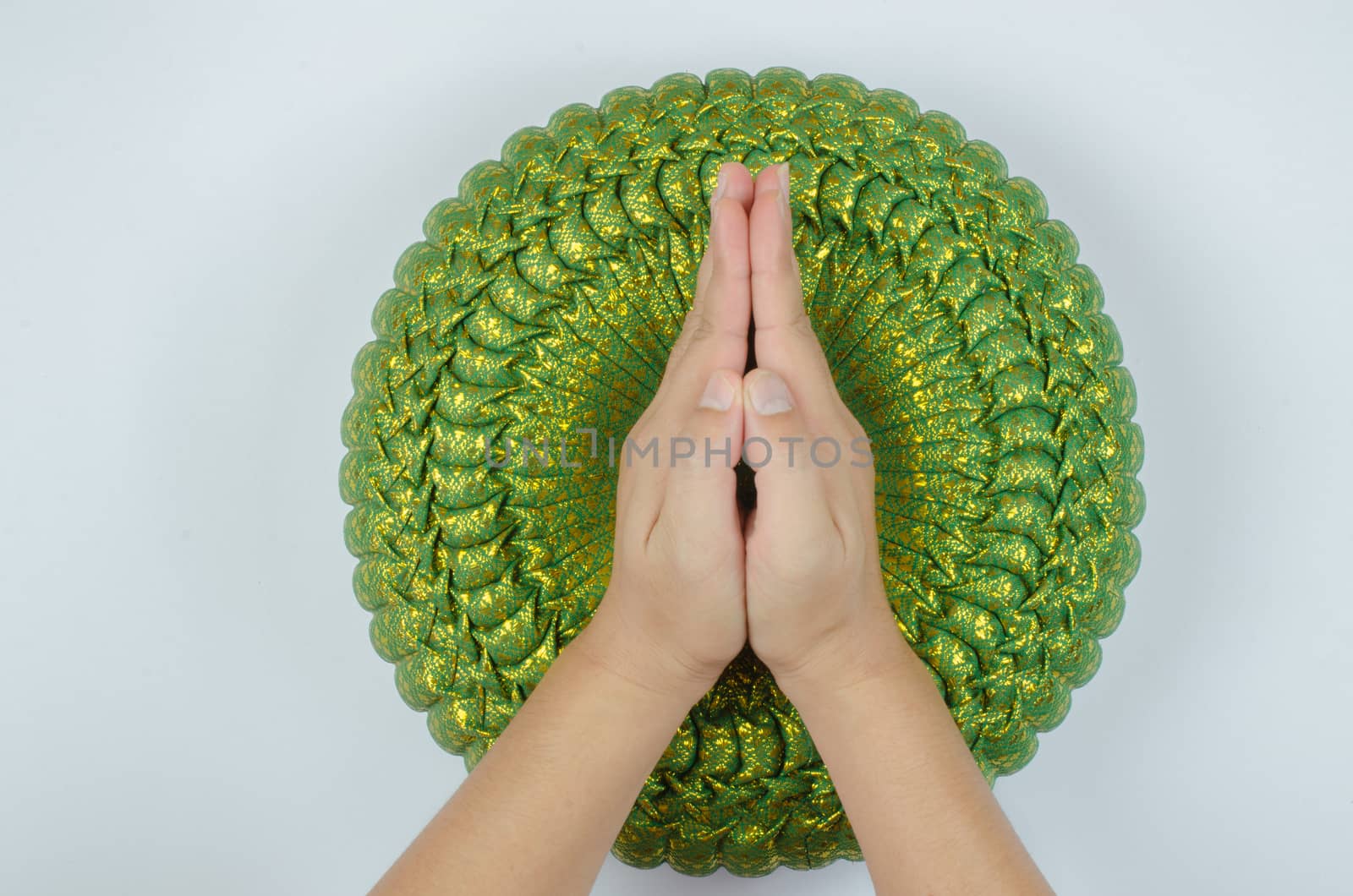 Thai silk Pumkin Pillow and hand on white background