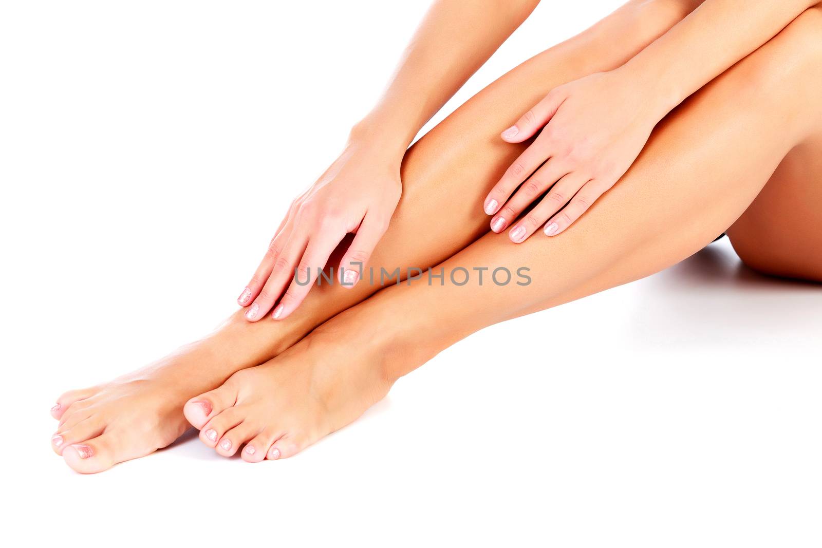 Woman's legs and hands, isolated on white background