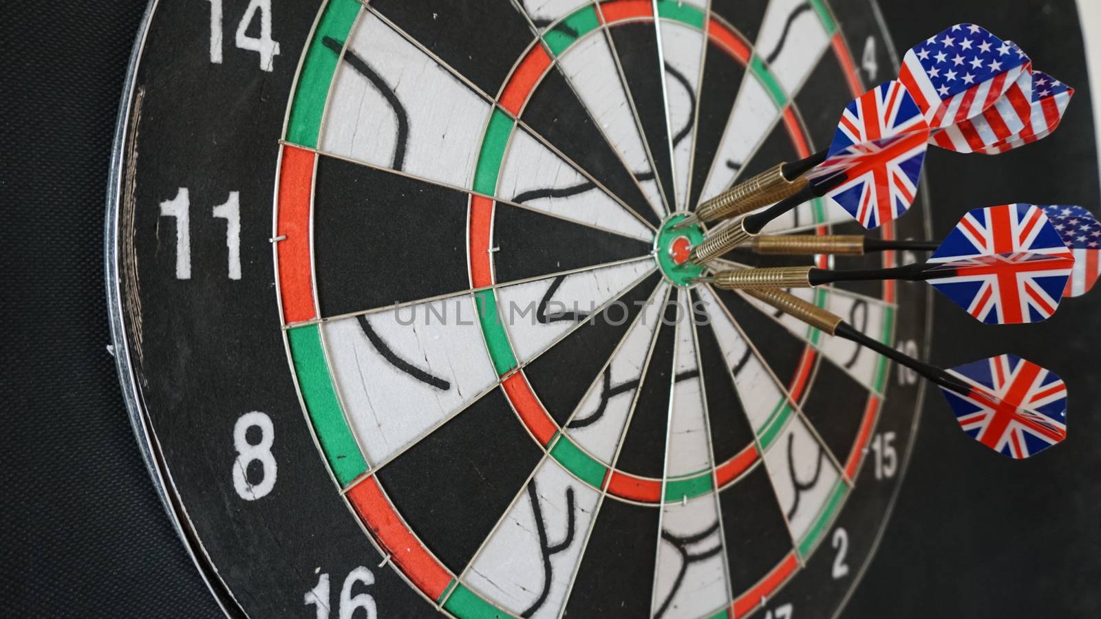 Business concept of darts. The target hanged on the wall.