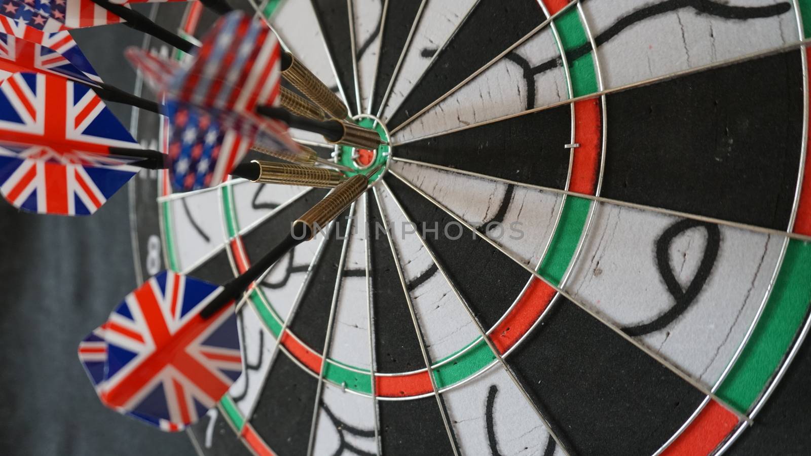 Business concept of darts. The target hanged on the wall.