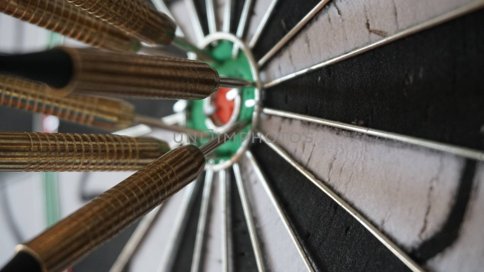 Business concept of darts. The target hanged on the wall.