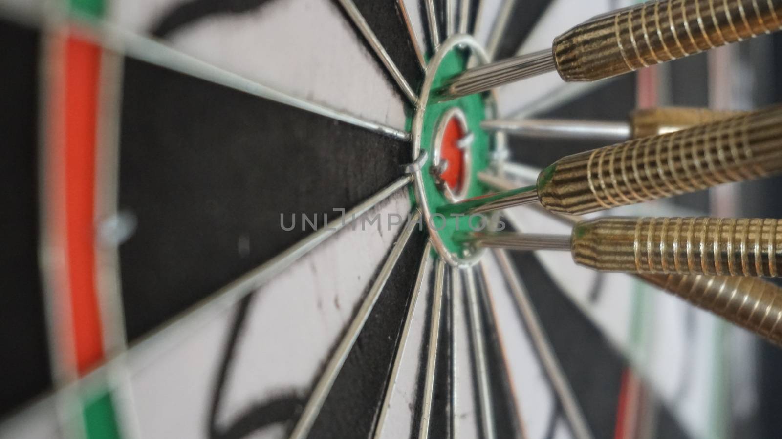 Business concept of darts. The target hanged on the wall.