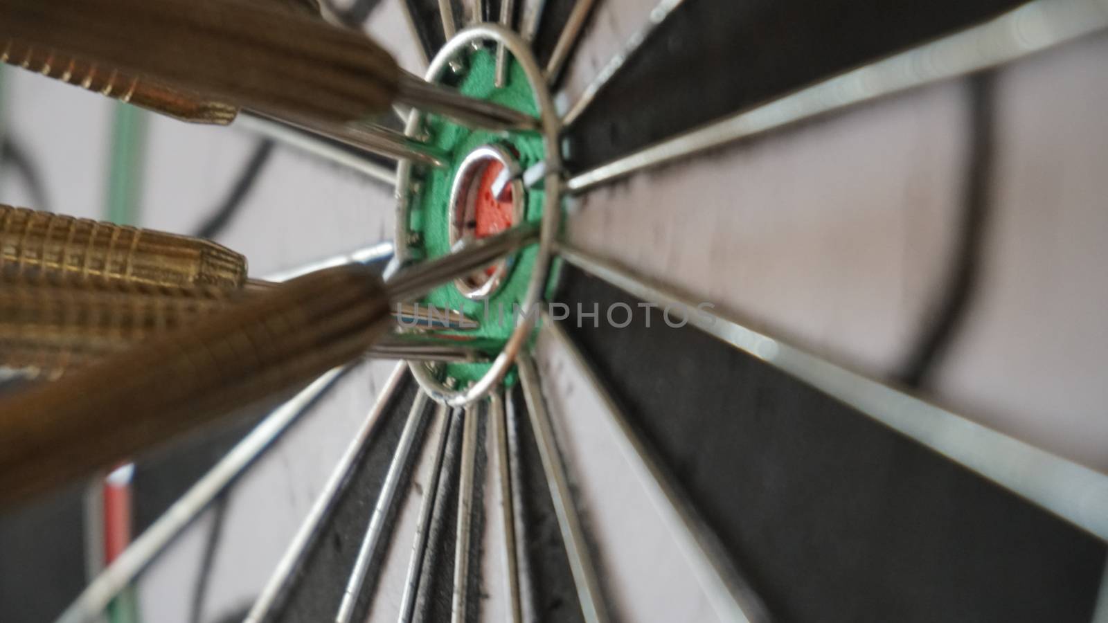 Business concept of darts. The target hanged on the wall.