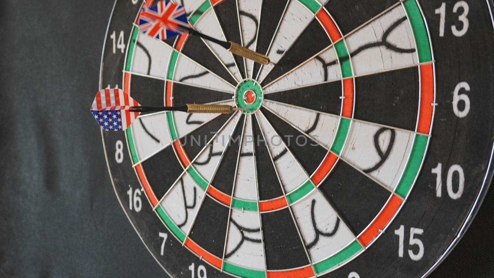 Business concept of darts. The target hanged on the wall.