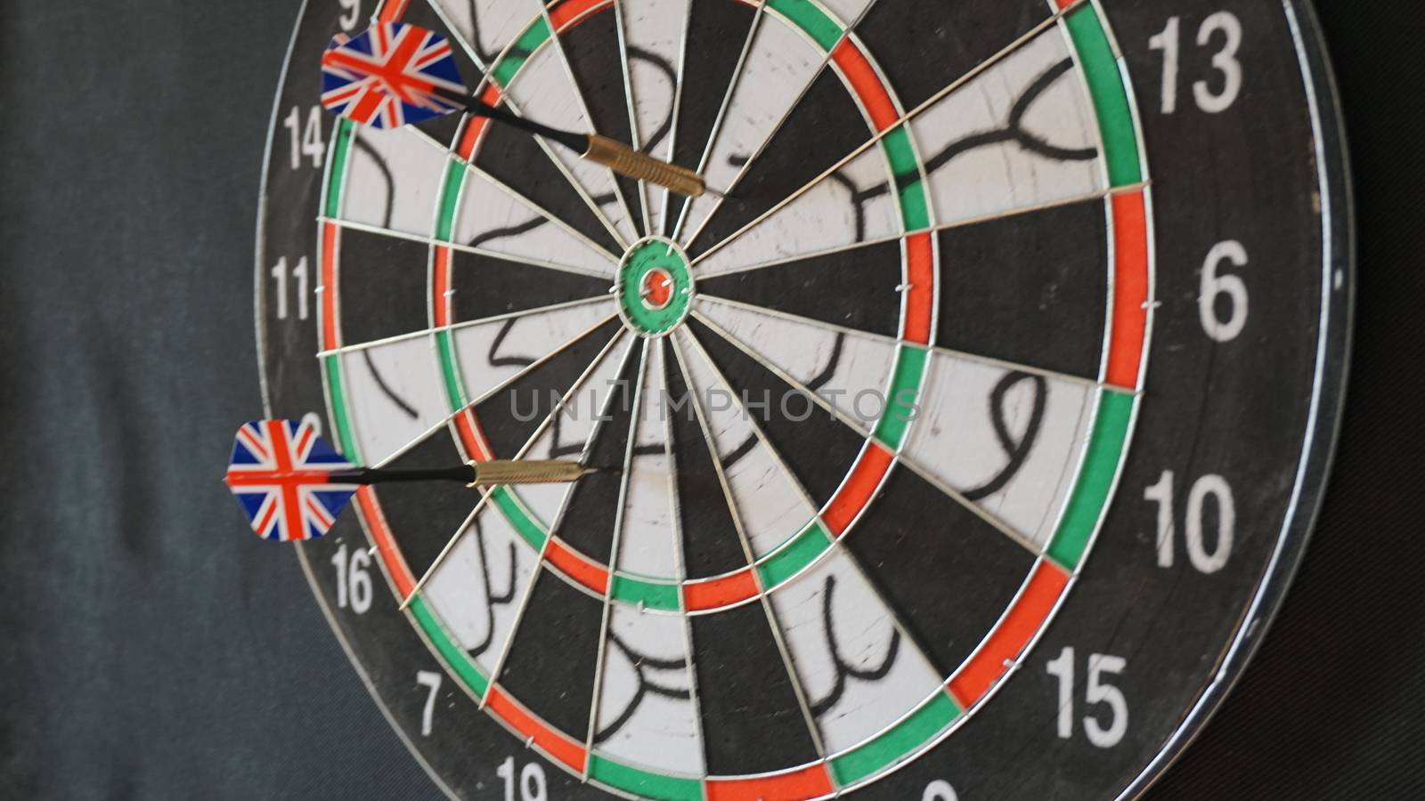 Business concept of darts. The target hanged on the wall.