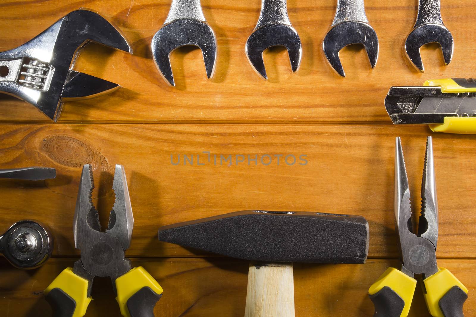 Set of tools for repair on a wooden background